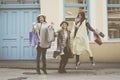 Three best friends jumping on the street.