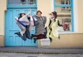 Three best friends jumping on the street.