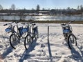 Three bicycle in snow near river Royalty Free Stock Photo