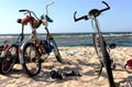 Three bicycles on a sandy beach of Baltic sea Royalty Free Stock Photo