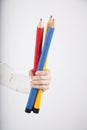 Three big pencils in hand Royalty Free Stock Photo