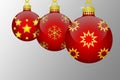 Three red hanging christmas tree balls with golden snowflakes and stars ornaments on a grey background Royalty Free Stock Photo