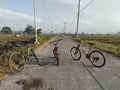 three bikes in the middle of the road