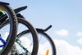 Three bikes in a row against the blue sky. bicycle ride