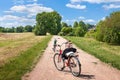 Three bikes on village road wild forest and blue sky sunny summer day background.