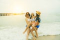 Three bikini asian woman happiness with relaxing emotion in vacation sea beach