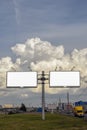 Billboards for advertising, text, illustrations and pictures on a background of beautiful thick clouds near the road