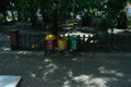 Three bins with three different colors for different types of trash. trash can in city park Royalty Free Stock Photo