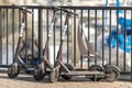 Three BIRD scooters on a sidewalk low angle view