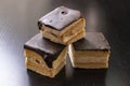 Three biscuit cakes on a wooden table