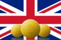 Three Bitcoin cryptocurrency with UNITED KINGDOM flag on background