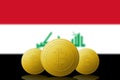 Three Bitcoins cryptocurrency with Irak flag on background