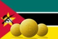 Three Bitcoins cryptocurrency with Mozambique flag on background