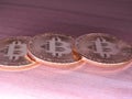 Bitcoins on wooden background. Royalty Free Stock Photo
