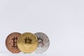 Three bitcoins standing together isolated.