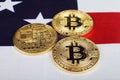Three bitcoins on the usa flag Royalty Free Stock Photo