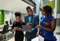 Black african colleagues walking through coworking workspace