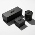 Three black boxes with a minimalist design are arranged on a white surfa Royalty Free Stock Photo