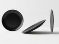 Three black circular objects in different orientations Royalty Free Stock Photo