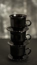 Three black coffee cups on black background Royalty Free Stock Photo