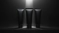 Three Black Cosmetic Tubes Under Spotlight Royalty Free Stock Photo