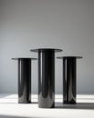 Three black cylindrical podiums on a black background Royalty Free Stock Photo