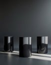Three black cylindrical podiums on a black background. Royalty Free Stock Photo