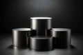 Three black cylindrical podiums on a black background Royalty Free Stock Photo