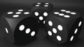 Three black dices on black background