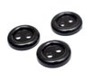 Three black plastic buttons, isolate on a white background Royalty Free Stock Photo