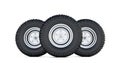 Three black tires. 3D render of Automotive wheel isolated on white background.