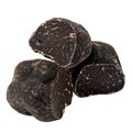 Three Black Truffles on a Black Background Royalty Free Stock Photo