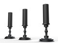 Three black wax candle on black candle holders Royalty Free Stock Photo