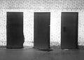 Three black and white closed doors background Royalty Free Stock Photo