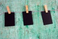 Three blank black paper sheets on a cloth line Royalty Free Stock Photo