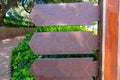 Three blank directional signs pointing to the left in a park or forest Royalty Free Stock Photo