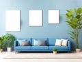 Three blank frames mockup for artwork or print on white wall with blue couch eucalyptus green plants in vase, copy space. Interior Royalty Free Stock Photo