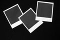 Three blank instant photo frames on black background with copy space top view Royalty Free Stock Photo