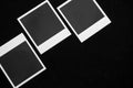 Three blank instant photo frames on black background with copy space top view Royalty Free Stock Photo