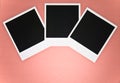 Three blank instant photo frames on pink red background with copy space top view Royalty Free Stock Photo