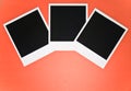 Three blank instant photo frames on red background with copy space top view Royalty Free Stock Photo