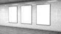 Three blank light boxes on white tiles wall Royalty Free Stock Photo