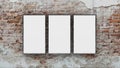 Three blank photo frames on brick wall 3d render Royalty Free Stock Photo