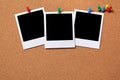 Three blank polaroid frame photo print pushpin cork background