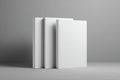Three Blank White Books Mockup on Grey Background Royalty Free Stock Photo