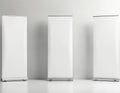 Three blank roll up banners stand against a white background. Empty banners are ready for custom design. Roll up displays are Royalty Free Stock Photo