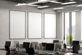 Three blank vertical posters mock up on the white brick wall in office interior. Royalty Free Stock Photo