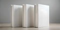 Three blank white books standing upright on a light grey background. Minimalist design. Ideal for mockups or design templates Royalty Free Stock Photo