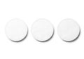 Three blank white circular coasters casting subtle shadows on a clean white surface Royalty Free Stock Photo