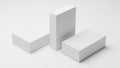 Three blank white rectangular boxes arranged together on a minimal white background, perfect for product packaging mockup design Royalty Free Stock Photo